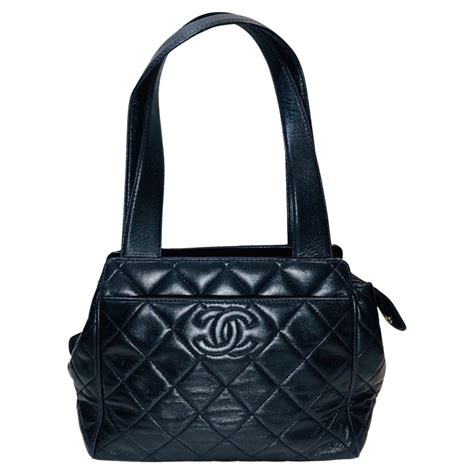 vintage chanel purse with embossed logo